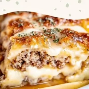 Delicious overnight sausage pancake casserole with syrup drizzle